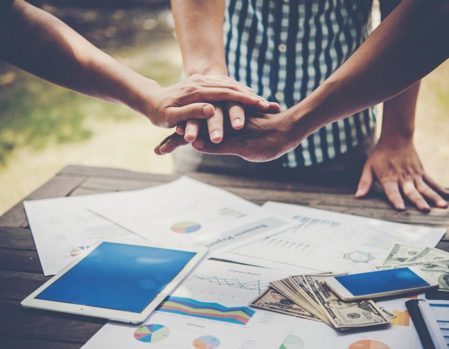 business-people-making-pile-hands-teamwork-concept_1150-1821